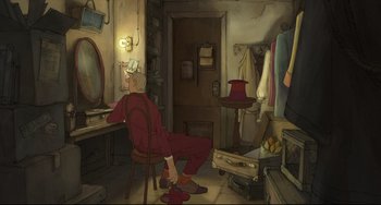 Movie still from “The Illusionist” (2010), directed by Sylvain Chomet – An old man sitting on a chair in a room; Wide shot, High angle