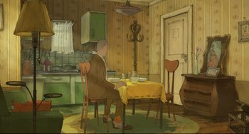 Movie still from “The Illusionist” (2010), directed by Sylvain Chomet – A man sitting at a dinner table in a kitchen; Wide shot, High angle