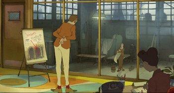 Movie still from “The Illusionist” (2010), directed by Sylvain Chomet – An animated scene of a man standing in front of an easel; Wide shot, High angle
