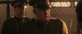 Movie still from “The Immigrant” (2013), directed by James Gray – An older man in a military uniform looking at the camera; Close Up shot, Low angle