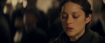 Movie still from “The Immigrant” (2013), directed by James Gray – A person with eyes closed; Close Up shot, Over the shoulder angle