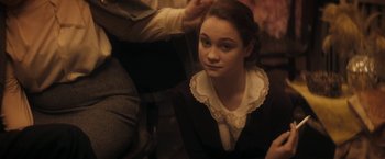 Movie still from “The Immigrant” (2013), directed by James Gray – A young woman sitting on the ground in a room; Close Up shot, High angle