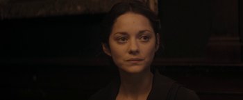 Movie still from “The Immigrant” (2013), directed by James Gray – A person wearing a black shirt; Close Up shot, Over the shoulder angle