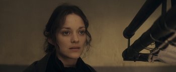 Movie still from “The Immigrant” (2013), directed by James Gray – A person wearing a black shirt; Close Up shot, Over the shoulder angle