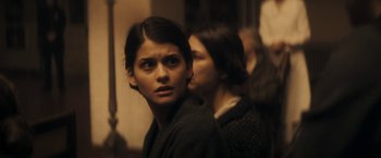 Movie still from “The Immigrant” (2013), directed by James Gray – Two women standing next to each other in a room; Close Up shot, Over the shoulder angle