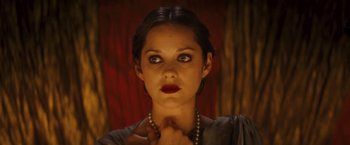 Movie still from “The Immigrant” (2013), directed by James Gray – A beautiful woman with red lipstick wearing a necklace; Close Up shot, Over the shoulder angle