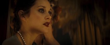 Movie still from “The Immigrant” (2013), directed by James Gray – A person with makeup on; Close Up shot, Over the shoulder angle