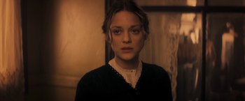 Movie still from “The Immigrant” (2013), directed by James Gray – A young woman in a black sweater and white shirt; Close Up shot, Over the shoulder angle