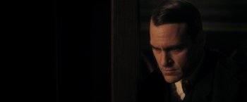 Movie still from “The Immigrant” (2013), directed by James Gray – A person looking out of a window; Close Up shot, Over the shoulder angle