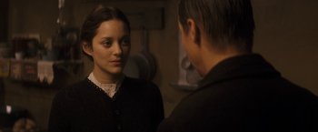 Movie still from “The Immigrant” (2013), directed by James Gray – A woman standing next to a man in front of a mirror; Close Up shot, Over the shoulder angle