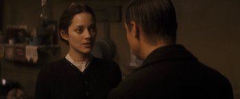 Movie still from “The Immigrant” (2013), directed by James Gray – A man and a woman looking at one another in a mirror; Close Up shot, Over the shoulder angle