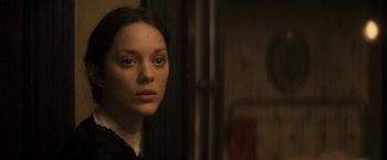 Movie still from “The Immigrant” (2013), directed by James Gray – A woman in a black shirt is looking at the camera; Close Up shot, Over the shoulder angle