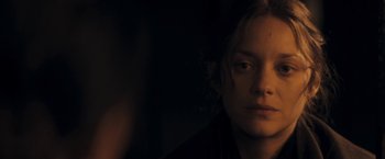 Movie still from “The Immigrant” (2013), directed by James Gray – A young woman is looking into the camera; Close Up shot, Over the shoulder angle