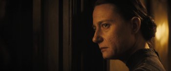 Movie still from “The Immigrant” (2013), directed by James Gray – A woman looking out of a window at night; Close Up shot, Over the shoulder angle