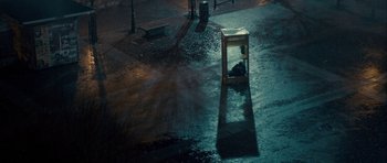 Movie still from “The Imposter” (2012), directed by Bart Layton – An image of an empty street at night time; Extreme Wide shot, High angle