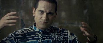 Movie still from “The Imposter” (2012), directed by Bart Layton – A person wearing a shirt; Close Up shot, Low angle