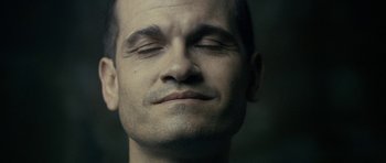 Movie still from “The Imposter” (2012), directed by Bart Layton – A person with his eyes closed; Extreme Close Up shot, High angle
