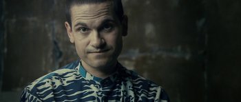 Movie still from “The Imposter” (2012), directed by Bart Layton – A person wearing a shirt; Close Up shot, Over the shoulder angle
