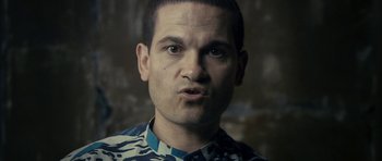Movie still from “The Imposter” (2012), directed by Bart Layton – A person wearing a camouflage shirt; Close Up shot, Low angle