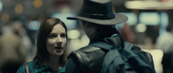 Movie still from “The Imposter” (2012), directed by Bart Layton – A woman talking to a man wearing a hat; Close Up shot, Over the shoulder angle