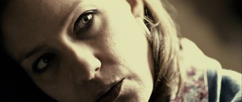 Movie still from “The Imposter” (2012), directed by Bart Layton – A woman's face with green eyes; Extreme Close Up shot, Low angle
