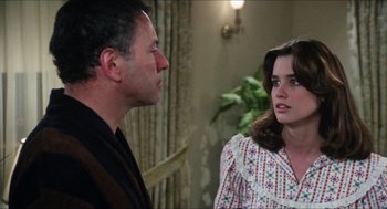 Movie still from “The In-Laws” (1979), directed by Arthur Hiller – A man and a woman talking to each other; Medium shot, Over the shoulder angle