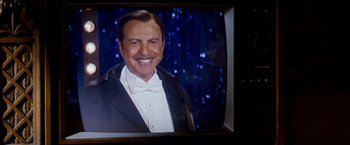 Movie still from “The Incredible Burt Wonderstone” (2013), directed by Don Scardino – A man in a tuxedo smiling for the camera; Close Up shot, Low angle