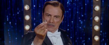 Movie still from “The Incredible Burt Wonderstone” (2013), directed by Don Scardino – A person wearing a suit and bow tie; Close Up shot, Over the shoulder angle