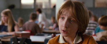 Movie still from “The Incredible Burt Wonderstone” (2013), directed by Don Scardino – A young boy is looking into the distance; Close Up shot, Over the shoulder angle