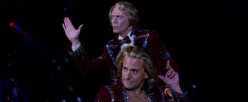 Movie still from “The Incredible Burt Wonderstone” (2013), directed by Don Scardino – Two men dressed in sequined suits and wigs; Medium shot, Low angle