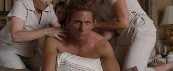 Movie still from “The Incredible Burt Wonderstone” (2013), directed by Don Scardino – A man with a towel on his chest; Medium shot, High angle
