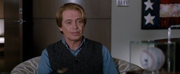 Movie still from “The Incredible Burt Wonderstone” (2013), directed by Don Scardino – A person sitting on a couch; Close Up shot, Over the shoulder angle