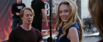 Movie still from “The Incredible Burt Wonderstone” (2013), directed by Don Scardino – A woman smiles while standing next to a man; Close Up shot, Over the shoulder angle
