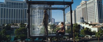 Movie still from “The Incredible Burt Wonderstone” (2013), directed by Don Scardino – Two people are standing in a glass box; Wide shot, Low angle