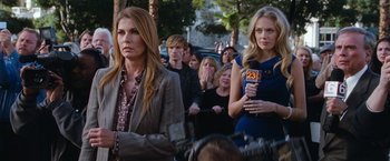 Movie still from “The Incredible Burt Wonderstone” (2013), directed by Don Scardino – A group of people standing in front of a camera; Medium shot, Over the shoulder angle