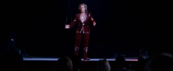 Movie still from “The Incredible Burt Wonderstone” (2013), directed by Don Scardino – A man in a red suit is on a rope; Wide shot, Low angle