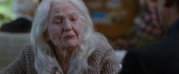 Movie still from “The Incredible Burt Wonderstone” (2013), directed by Don Scardino – An old woman with white long hair and a sweater; Close Up shot, Over the shoulder angle