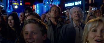 Movie still from “The Incredible Burt Wonderstone” (2013), directed by Don Scardino – A crowd of people standing in the middle of a street; Medium shot, Low angle