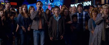 Movie still from “The Incredible Burt Wonderstone” (2013), directed by Don Scardino – A group of people standing in front of a building; Wide shot, Low angle