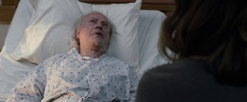 Movie still from “The Incredible Burt Wonderstone” (2013), directed by Don Scardino – An older man laying in a hospital bed; Medium shot, High angle
