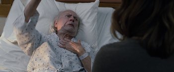 Movie still from “The Incredible Burt Wonderstone” (2013), directed by Don Scardino – An older man laying in a hospital bed; Close Up shot, Over the shoulder angle