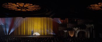 Movie still from “The Incredible Burt Wonderstone” (2013), directed by Don Scardino – A man standing on a stage in front of an audience; Extreme Wide shot, High angle