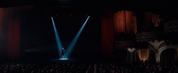 Movie still from “The Incredible Burt Wonderstone” (2013), directed by Don Scardino – A man standing on a stage in front of a crowd of onlookers; Extreme Wide shot, High angle