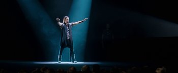 Movie still from “The Incredible Burt Wonderstone” (2013), directed by Don Scardino – A man standing on a stage in front of an audience; Wide shot, Low angle