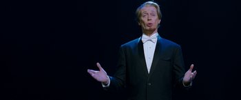 Movie still from “The Incredible Burt Wonderstone” (2013), directed by Don Scardino – A man wearing a tuxedo and a bow tie; Medium shot, Low angle