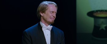 Movie still from “The Incredible Burt Wonderstone” (2013), directed by Don Scardino – A man in a suit and bow tie; Close Up shot, Over the shoulder angle