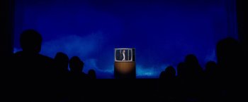 Movie still from “The Incredible Burt Wonderstone” (2013), directed by Don Scardino – An old television set sitting on top of a wooden stand; Extreme Wide shot, High angle