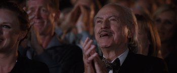 Movie still from “The Incredible Burt Wonderstone” (2013), directed by Don Scardino – An older man clapping his hands in front of a group of people; Close Up shot, Low angle