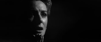 Movie still from “The Innocents” (1961), directed by Jack Clayton – A black and white photo of a woman crying; Close Up shot, Low angle