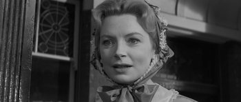 Movie still from “The Innocents” (1961), directed by Jack Clayton – An old photo of a woman wearing a head scarf; Close Up shot, Low angle